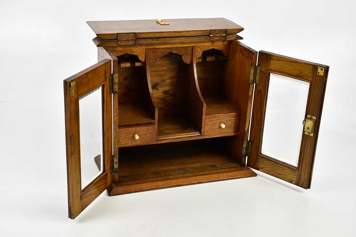 A 1920s oak smoker's cabinet with two glazed doors and a presentation plaque, five cigarette - Image 3 of 4