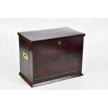 A late Victorian stained stationery cabinet with hinged cover and fall front releasing a spring