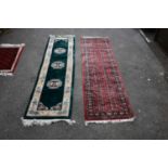 A Bokhara type wool runner, 306 x 80cm, with a Chinese green ground runner (2) Condition Report: