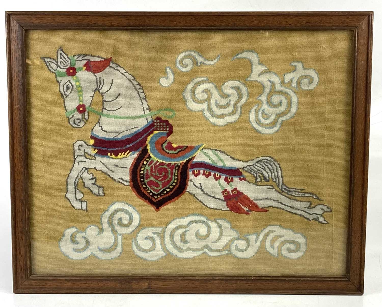 A tapestry picture of a flying horse, 38cm x 49cm, framed and glazed.