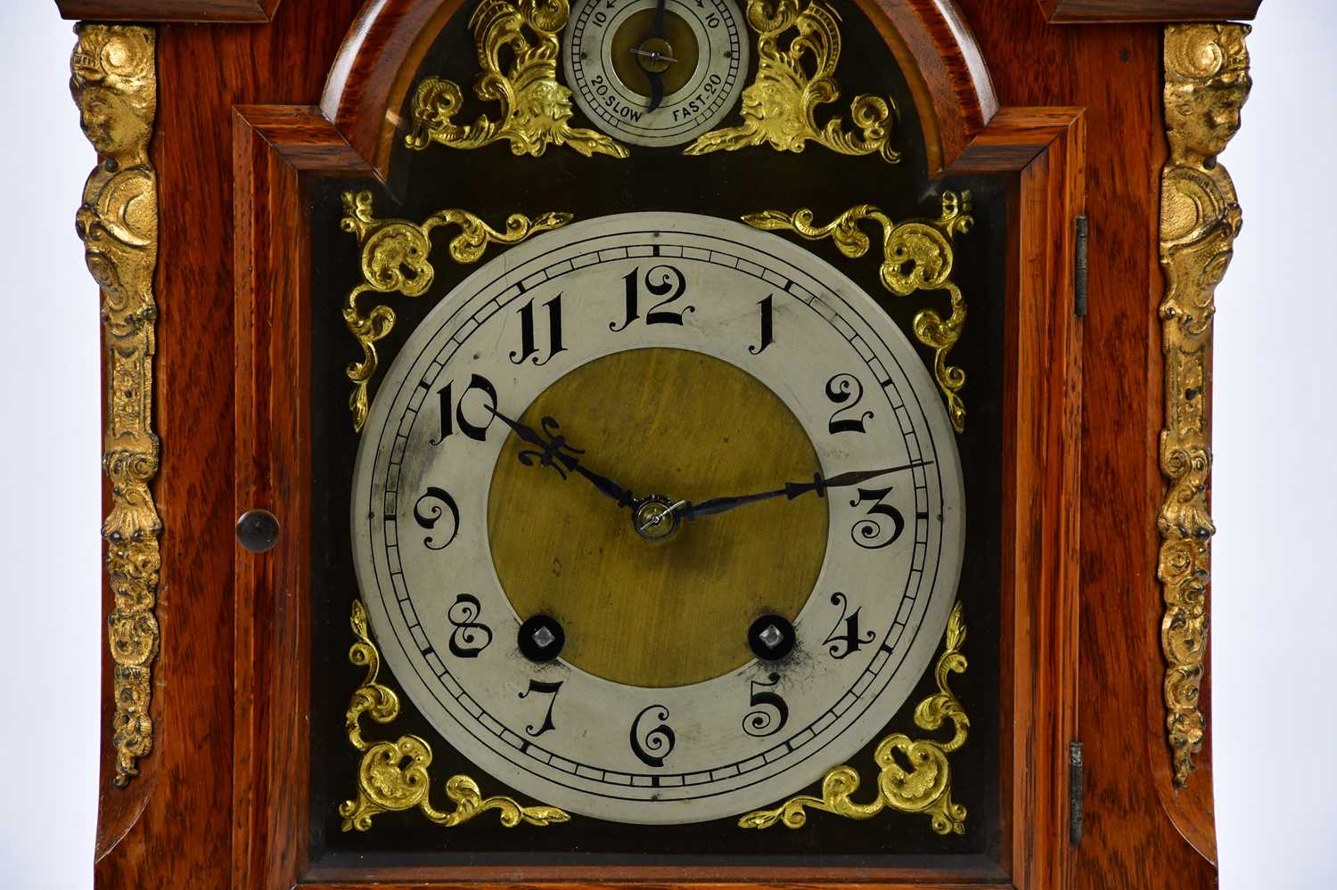 An early 20th century oak mantel clock with applied brass urn finial and four further scrolling - Image 2 of 6