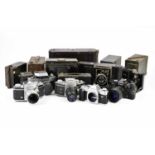 A collection of film cameras, to include a Canon AL-1 AF, an Exakta RTL1000 with a Oreston 50mm f1.8