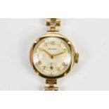 ENVOY; a 9ct yellow gold lady's wristwatch, approx 14.5g.