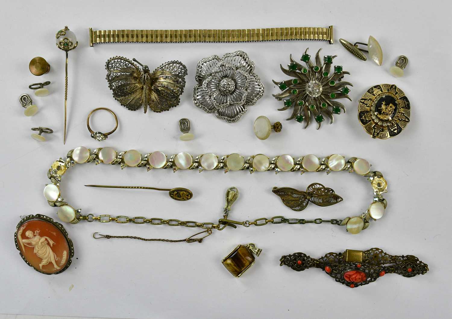 A small group of costume jewellery including filigree butterfly or insect brooch, stylish floral
