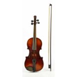 A German full sized violin, with 35.5cm two piece back and carved lion head scroll, with bow and