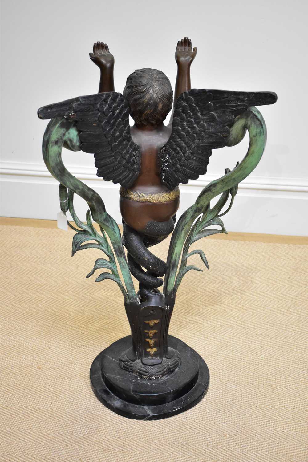 A modern decorative patinated metal figure of a standing cherub on marble base, height 90cm. - Image 4 of 4