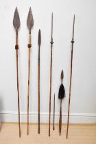 A collection of six African spears, two examples with animal hide handles, largest 200cm.