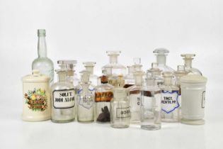 A collection of pharmaceutical bottles, predominantly glass, bearing etched labels, including EXT,