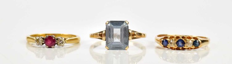An 18ct yellow gold diamond and sapphire three stone dress ring, size K, a yellow metal diamond