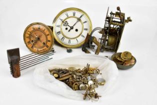 A collection of clock and watch parts to include faces, movements and cases.