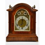 An Edwardian walnut eight day chiming mantel clock, the matted brass dial with silvered Roman