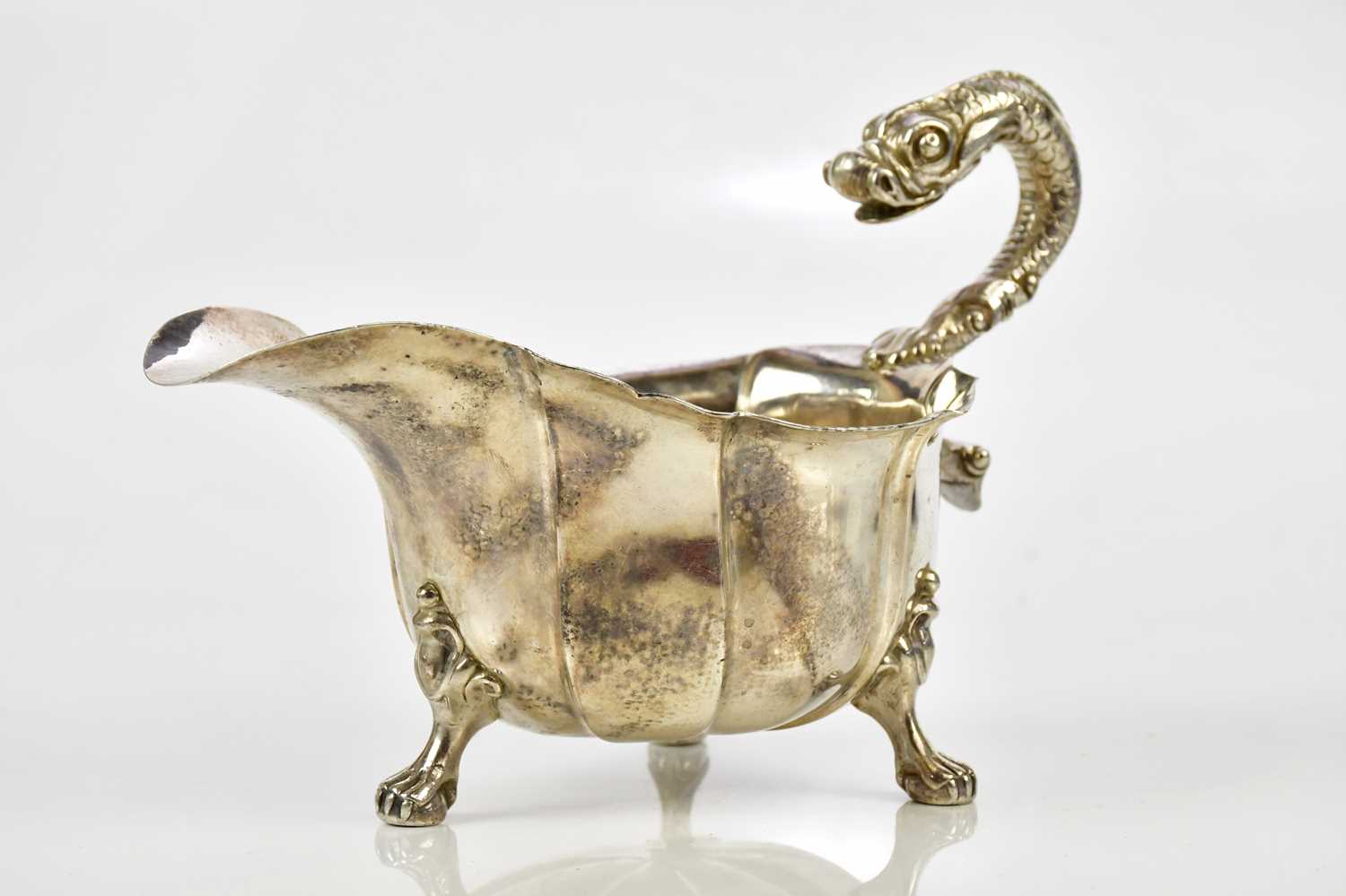 A good George III hallmarked silver sauceboat, with serpent handle and panelled body, on ball and - Image 3 of 7