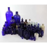 A collection of Victorian and later pharmaceutical bottles including 'POISON NOT TO BE TAKEN', etc.