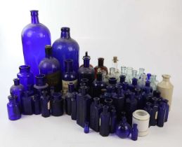 A collection of Victorian and later pharmaceutical bottles including 'POISON NOT TO BE TAKEN', etc.