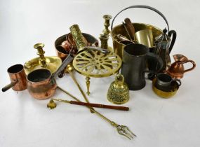 A collection of 19th century and later metalware including brass jam pan, chambersticks, pewter mug,