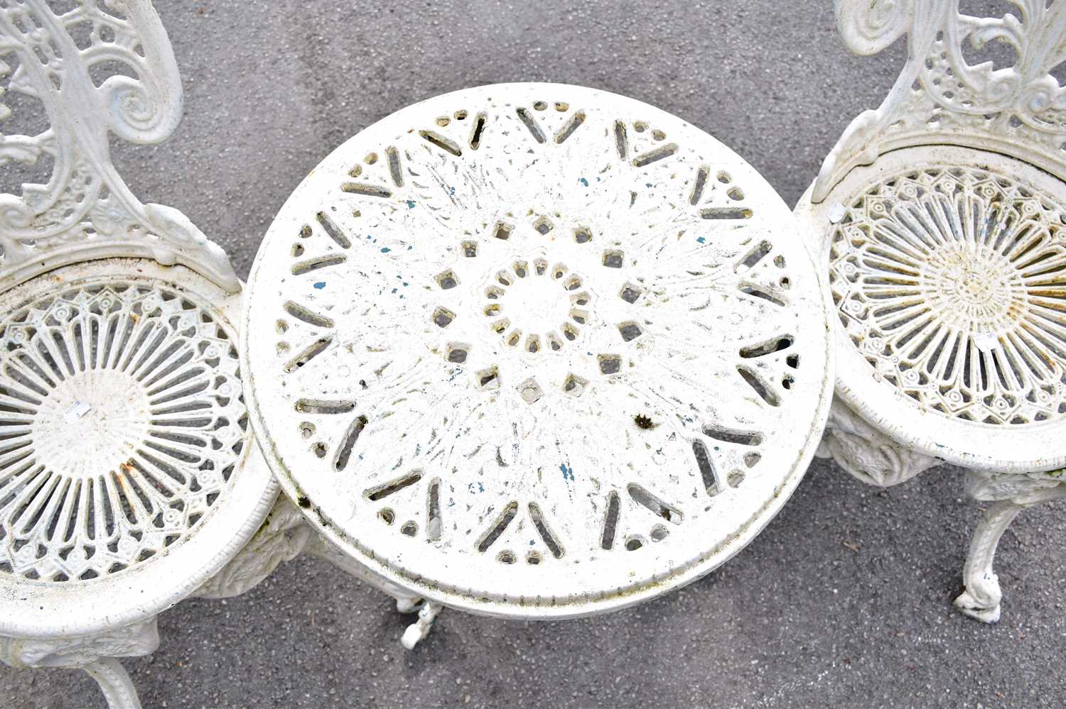 A pair of white painted cast iron chairs and a similar table (3). - Image 2 of 3