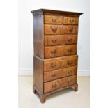 A George III walnut chest on chest, with two short and three long drawers, above three further