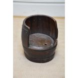 An unusual barrel chair formed as a metal bound bucket, height 35.5cm.