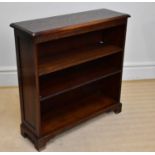 A reproduction oak freestanding bookcase with two adjustable shelves, on bracket feet, width 90cm,