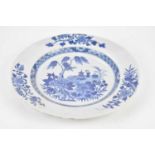 An 18th century Chinese Export blue and white plate, decorated with central scene of objects on a