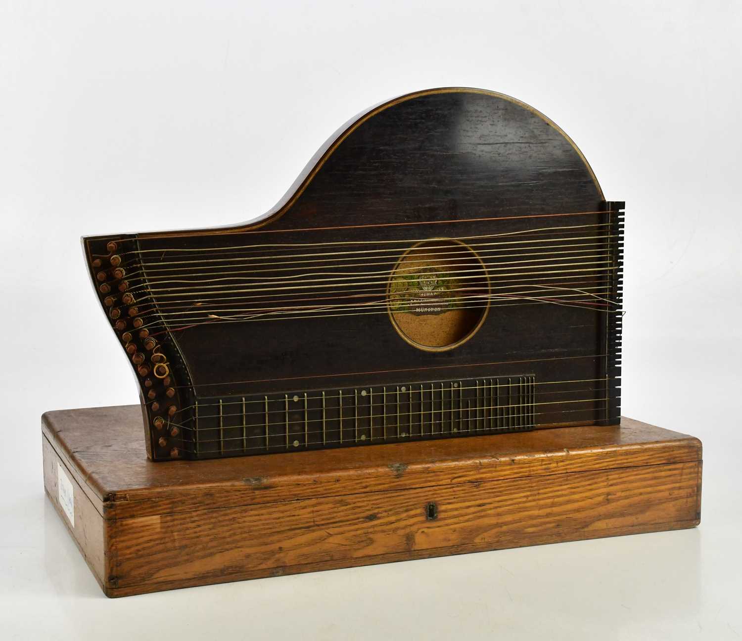 J HASLWANTER; a German rosewood zither in oak case.