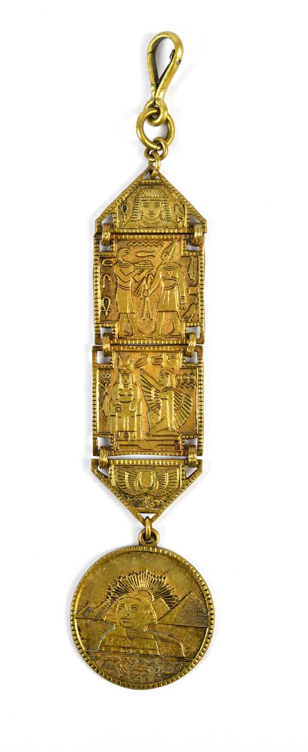 A 1920s Art Deco Egyptian Revival watch fob, 14.5cm, cased.