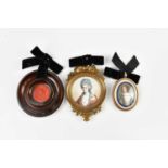 X Two portrait miniatures, both of seated maidens, together with a wax seal. Ivory Licence number;