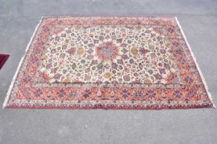 A wool carpet with beige ground and geometric pattern, 390 x 290cm.