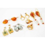 A pair of 9ct yellow gold amber earrings, together with four further pairs of yellow metal earrings,