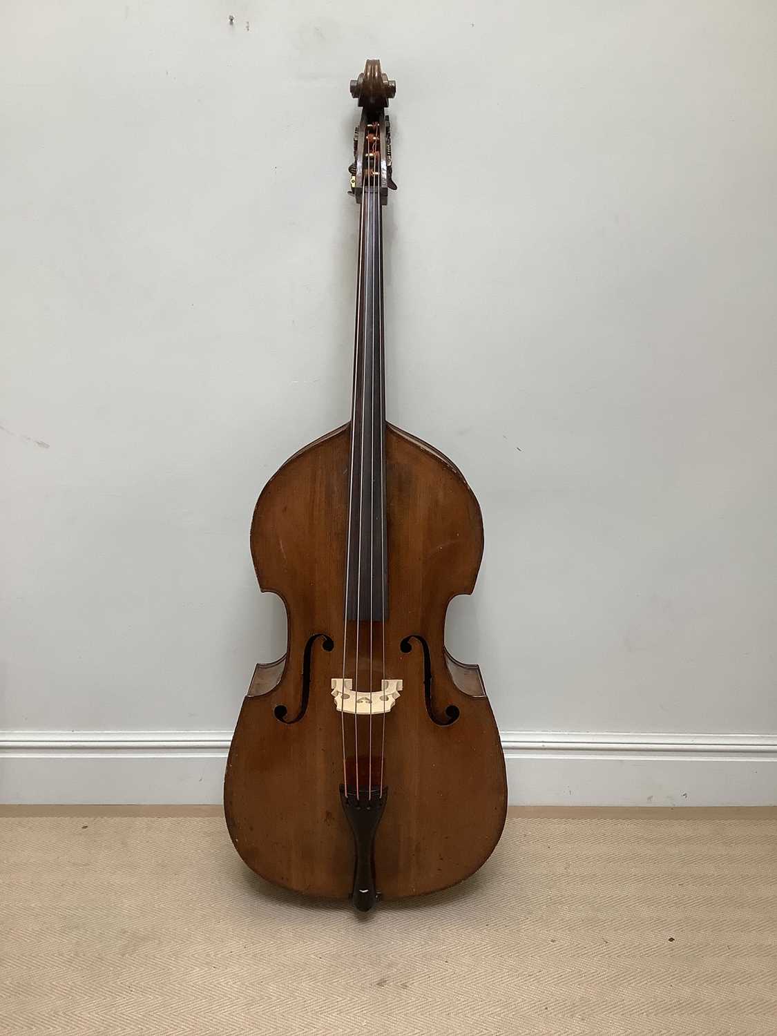 A double bass, possibly German, with 110cm two piece back, overall length 190cm.