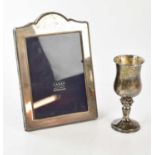 JOHN BULL LTD; an Elizabeth II hallmarked silver goblet, decorated with grapes, Birmingham 2000,