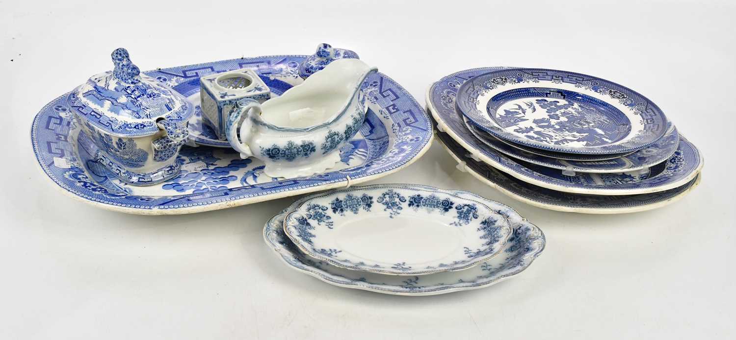 A collection of blue and white ceramics including an Ironstone 'Willow' pattern meat plate.