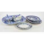 A collection of blue and white ceramics including an Ironstone 'Willow' pattern meat plate.