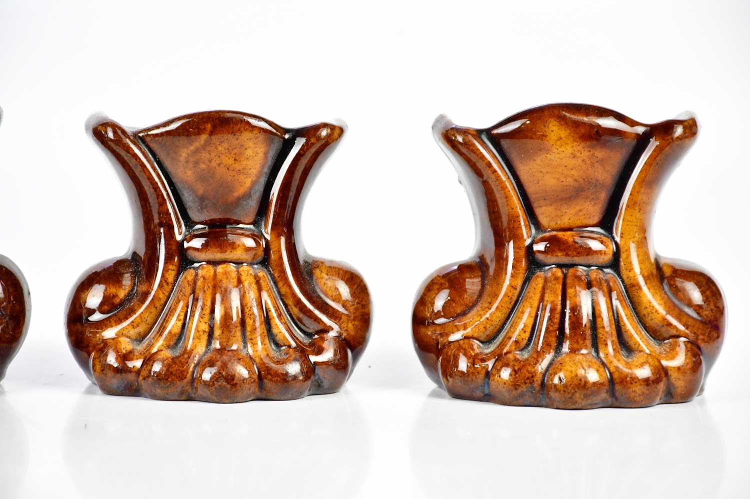 Two pairs of 19th century treacle glaze furniture rests modelled as scrolls, height 10.5cm (4). - Image 3 of 4