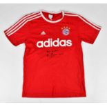 BECKENBAUER; a signed Bayern Munich retro style football shirt, signed to the front, size S.