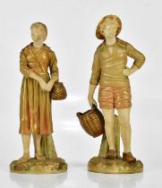 ROYAL WORCESTER; a pair of gilded blush ivory figures, a Dutch boy and girl holding baskets, factory