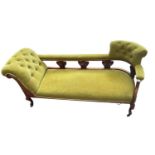 A late Victorian carved walnut framed chaise longue, length 184cm.