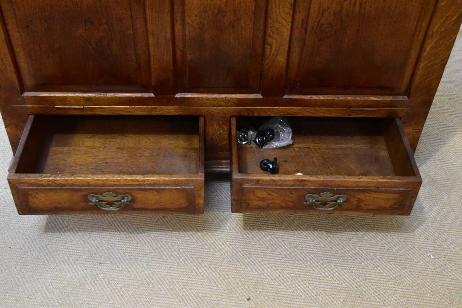 IN THE MANNER OF TITCHMARSH & GOODWIN; a reproduction oak blanket chest with panelled front and - Image 2 of 3