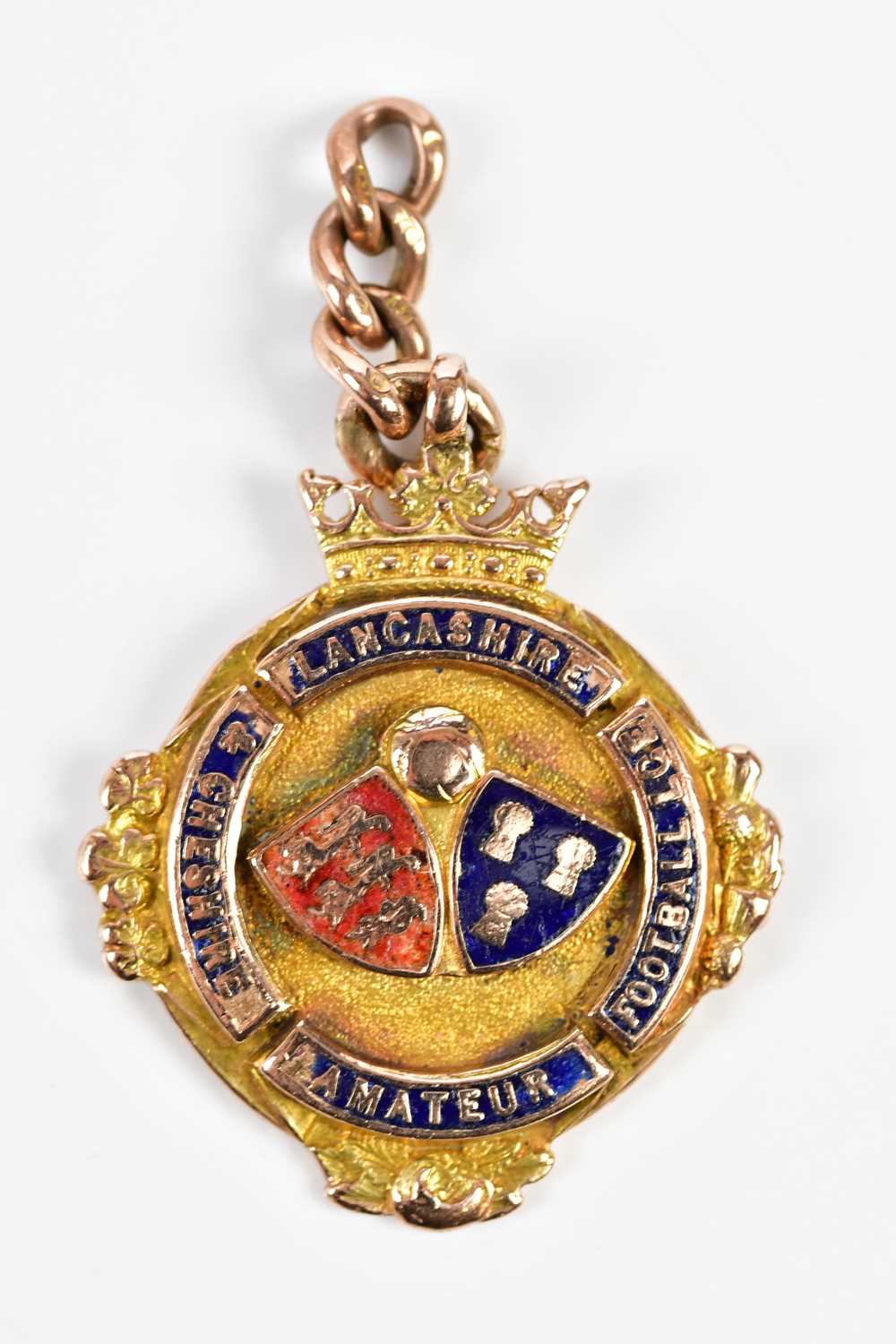 LANCASHIRE & CHESHIRE AMATEUR FOOTBALL; a 9ct yellow gold and enamel winners' medal, awarded to J