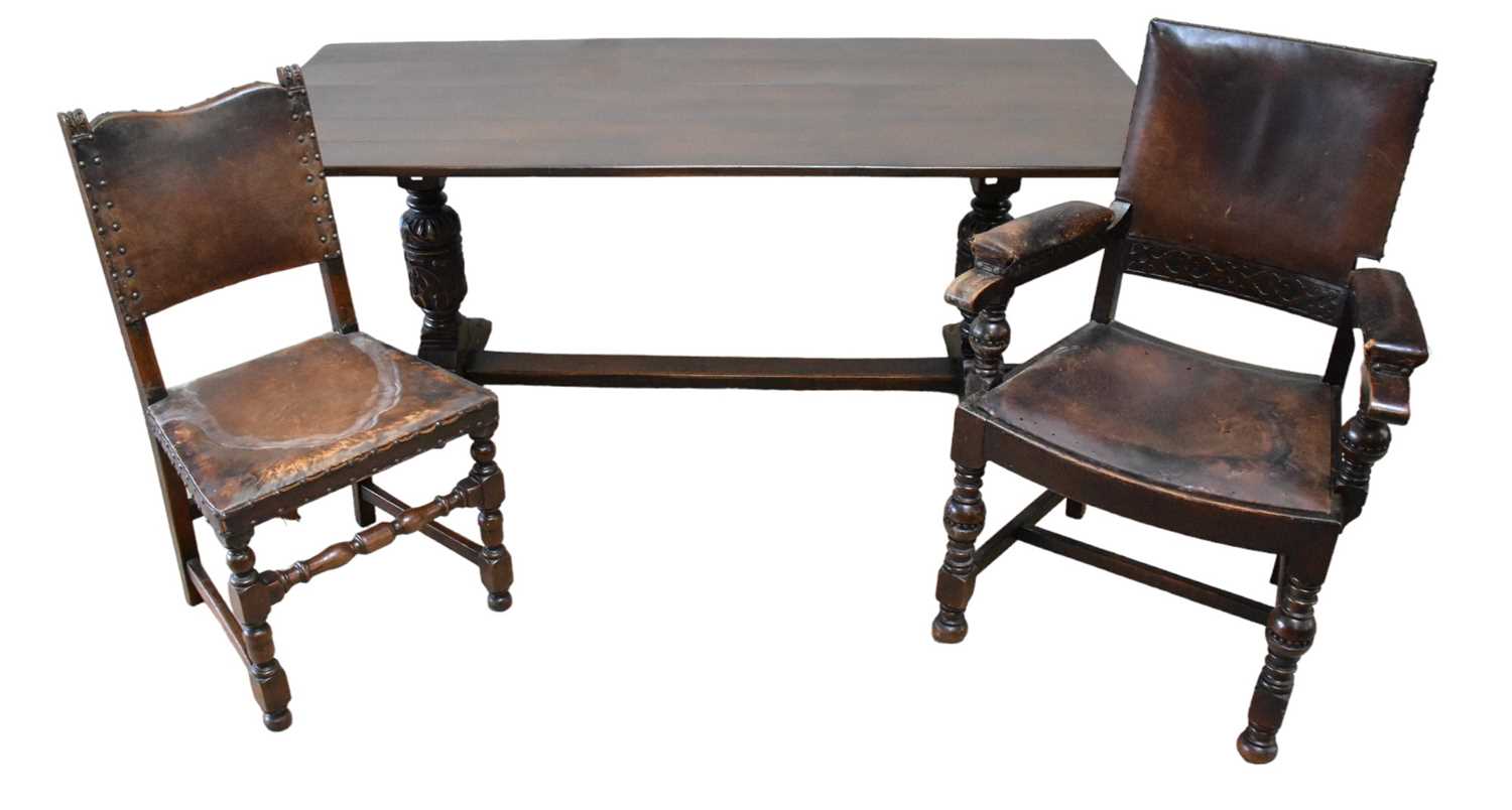 A late 19th century oak refectory table, together with six oak framed dining chairs with leather