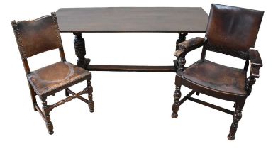A late 19th century oak refectory table, together with six oak framed dining chairs with leather