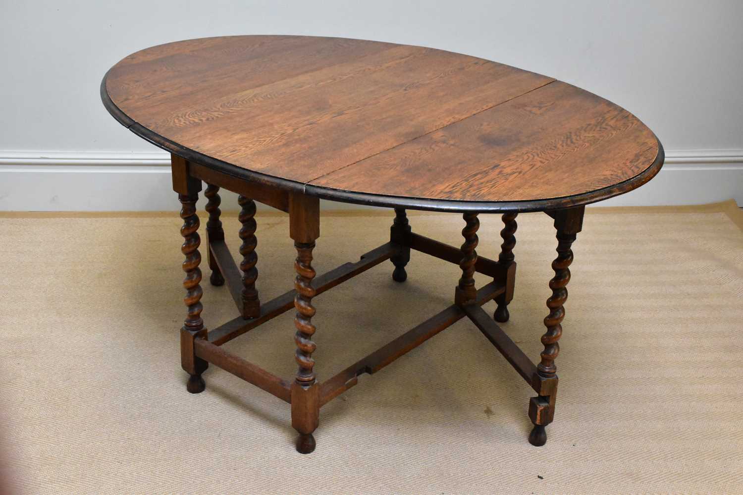 A 20th century oak gateleg table on barley twist legs, height 73cm, width 107cm, depth 56cm. - Image 2 of 2