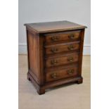 A modern oak media cupboard modelled as a four drawer chest on bracket feet, width 64cm, depth 48cm,