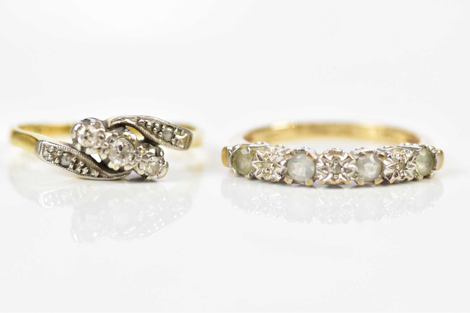 An 18ct yellow gold three stone diamond ring, size I, together with a 9ct yellow gold dress ring,
