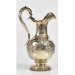 X EDWARD FARRELL; a good William IV hallmarked silver wine ewer, relief decorated with grape, vine