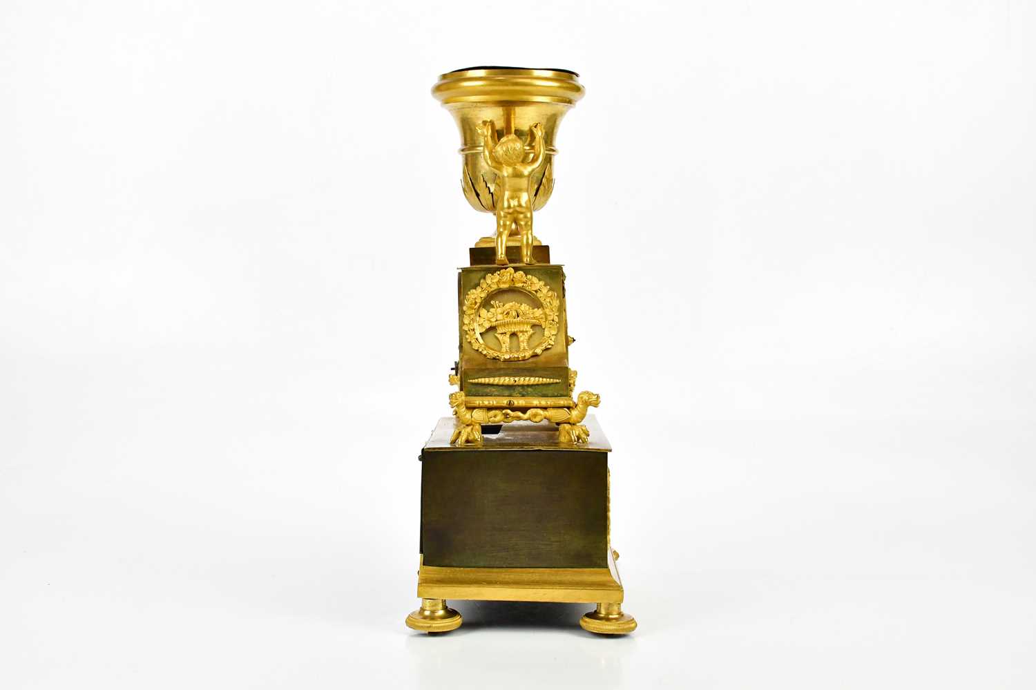 A late 19th century French ormolu mantel clock with cherubs supporting an urn finial above the - Image 5 of 7
