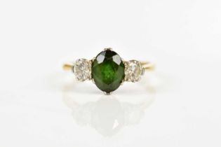 An 18ct gold and platinum diamond and tourmaline three stone ring, size K, approx 2.7g. Condition