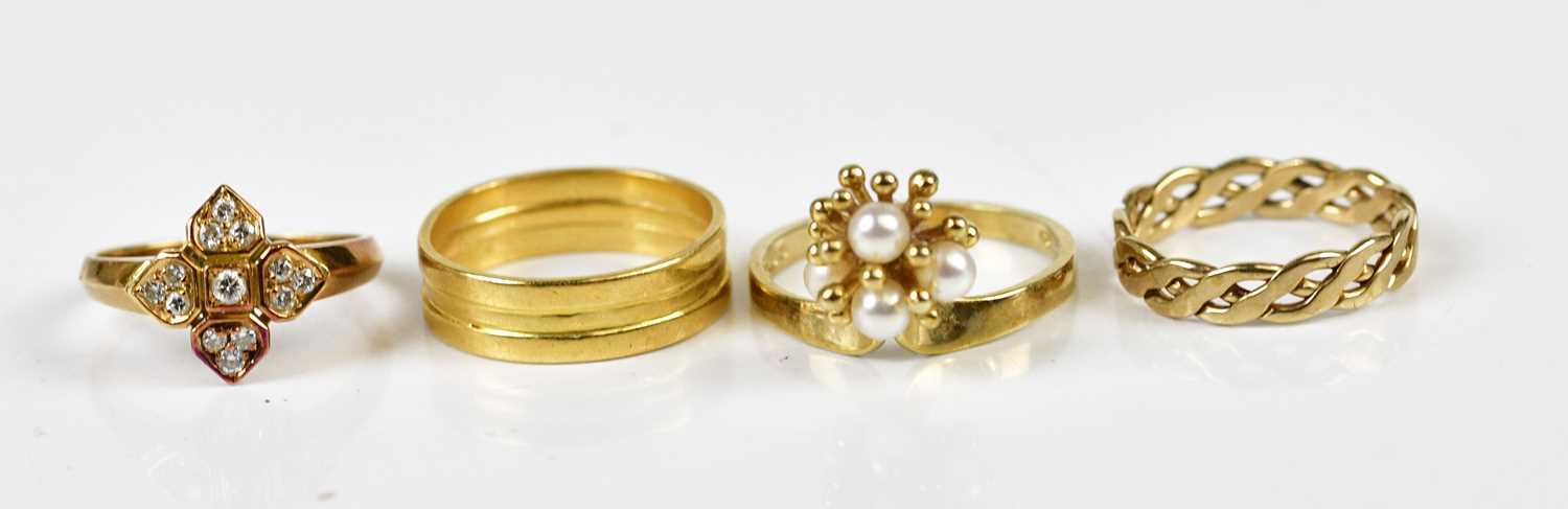 A 9ct yellow gold dress ring set with four pearls, approx size P 1/2, a 9ct yellow gold rope twist