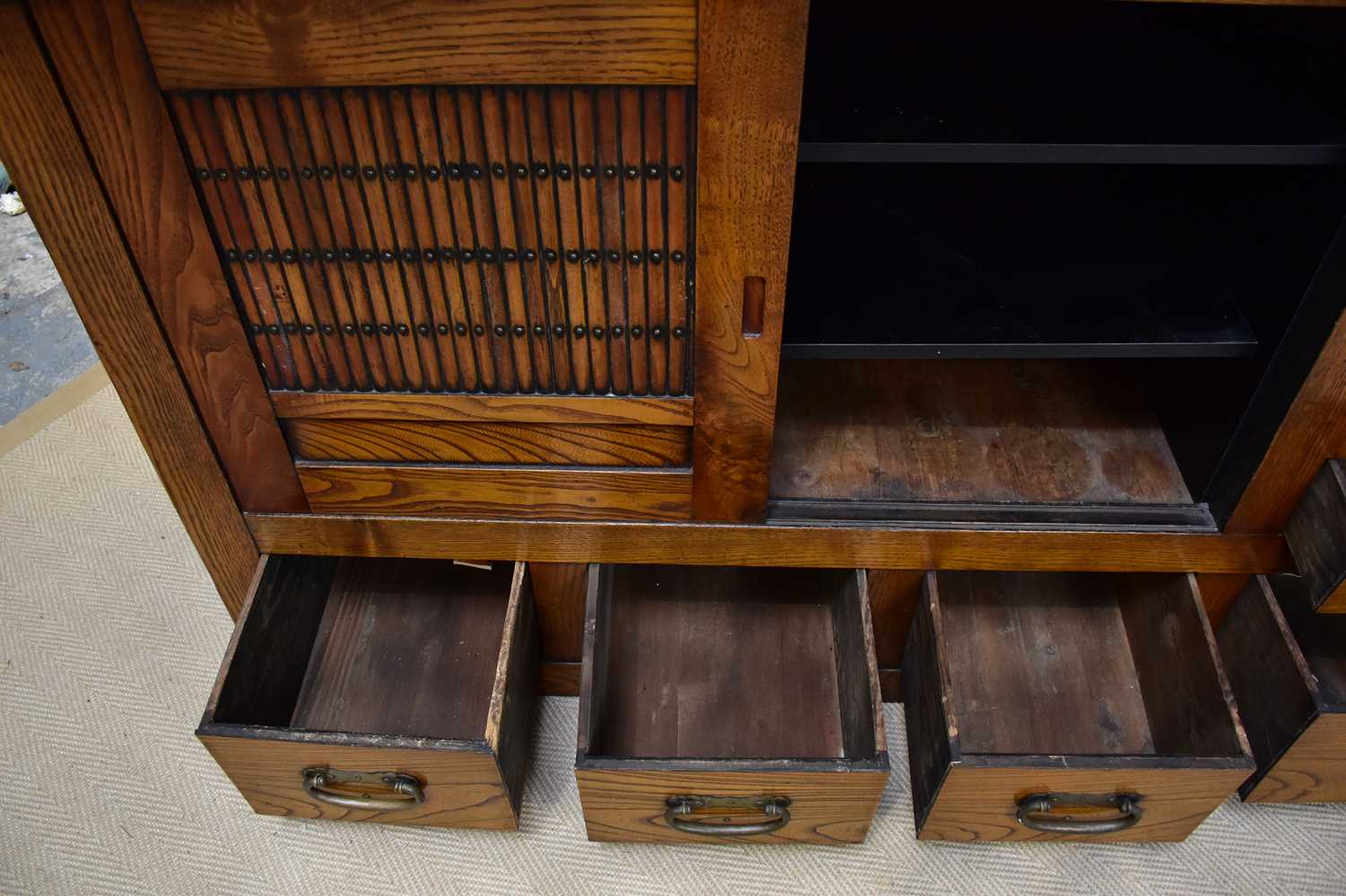 A 20th century Chinese elm cabinet of large proportions with an arrangement of sliding doors and - Image 3 of 3