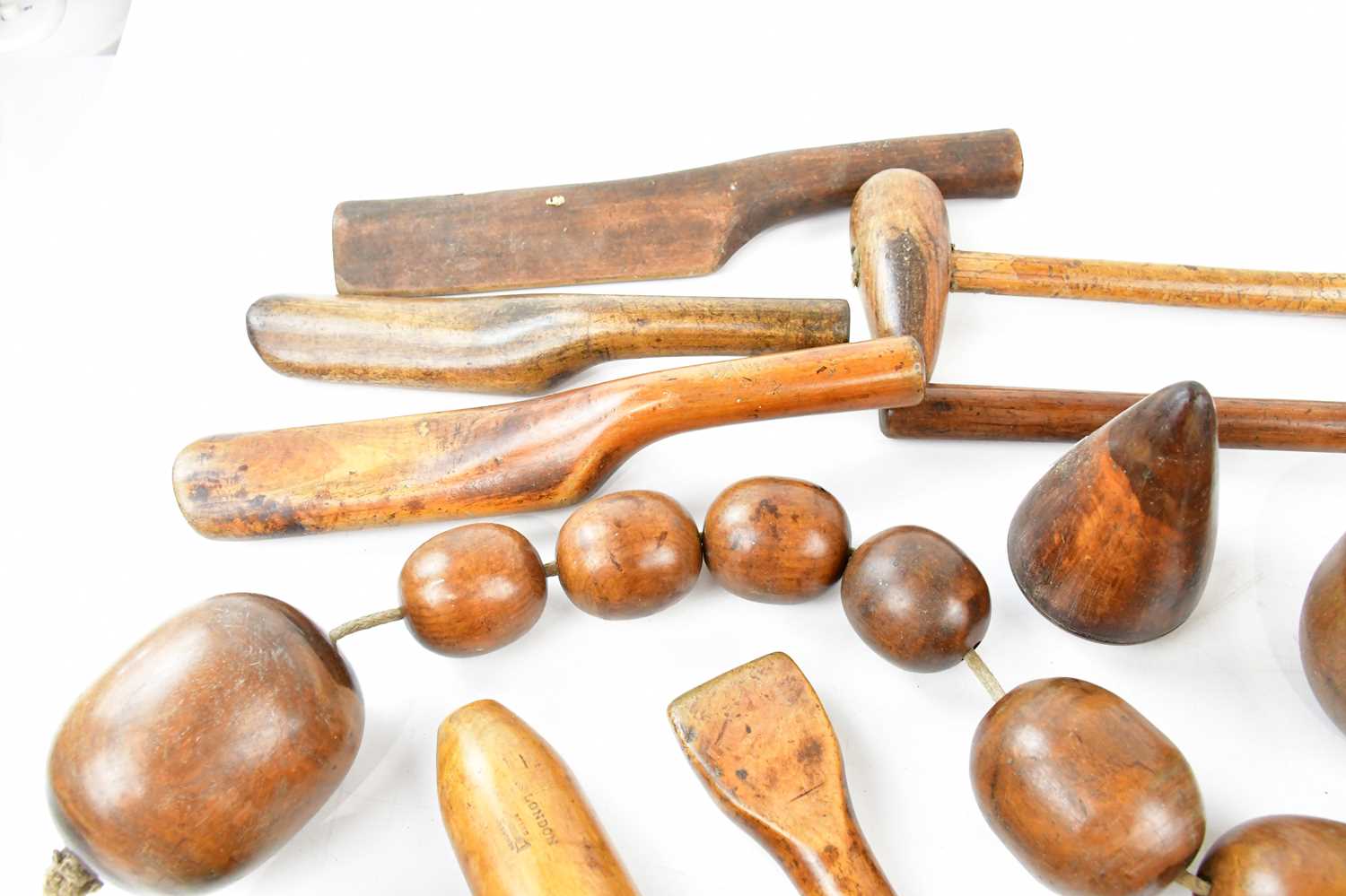 A collection of boxwood and lignum vitae vintage lead worker's tools. - Image 4 of 5
